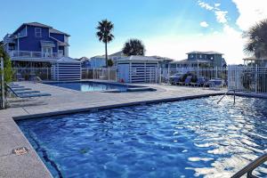 a swimming pool in front of some houses at Bay to Breakers in Fort Morgan