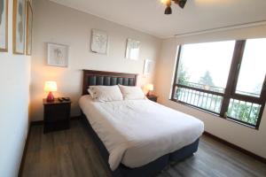 Postel nebo postele na pokoji v ubytování B002 Departamento con Hermosa Vista a Lago en Puerto Varas