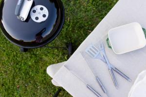 a table with a bowl with a toy soccer ball and scissors at Les jardins du Quesnoy - 25min de Pairi Daiza in Blicquy