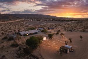 an aerial view of a venue in the desert at sunset at Desert Haven, Pickleball, Stargazing, Spa & Views in Joshua Tree