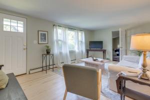 a living room with a couch and a table at No Pet Fee! Home with Private Yard in Rocky Point in Rocky Point