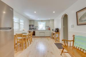 a kitchen and dining room with a table and chairs at No Pet Fee! Home with Private Yard in Rocky Point in Rocky Point +16 photos