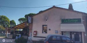 a car parked in front of a building with a sign at casa vacanze Villanova - 4 posti letto in Villanova