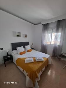 Ένα ή περισσότερα κρεβάτια σε δωμάτιο στο Apartamento Parral