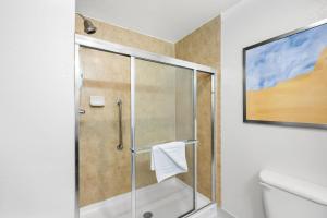 a shower with a glass door in a bathroom at Comfort Inn & Suites Fort Smith I-540 in Fort Smith +18 photos