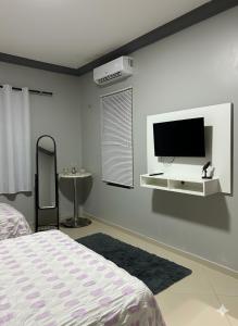 Et tv og/eller underholdning på Recanto do Aconchego Prime + 8 billeder