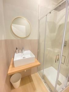 a bathroom with a sink and a shower at Dreamhouse B&B in Pioltello +33 photos