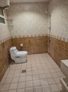 a bathroom with a toilet and a shower at نوارة المزاحمية in Riyadh +8 photos