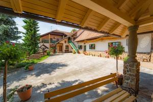 an outdoor patio with a wooden pergola at Winery Toplak in Juršinci