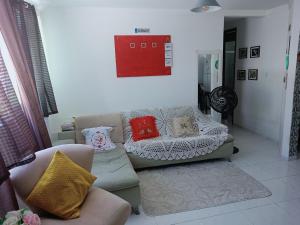 Posezení v ubytování Quarto Aconchegante