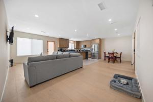 a living room with a couch and a kitchen at New Listing Valley Villa by Colby & Conrad in Winnetka