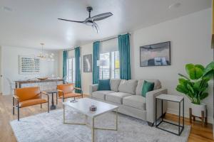 a living room with a couch and a table at Spacious 6 Bed 6 Bath Duplex with a Pool in Houston