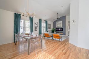 a dining room and living room with a table and chairs at Spacious 6 Bed 6 Bath Duplex with a Pool in Houston