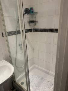 a bathroom with a shower and a sink at Shirley Guest Flat 1 in Southampton