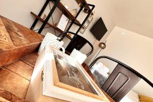 an image of a room with stairs and a room with at Lion - Centre-ville - MA CONCIERGERIE in Vesoul