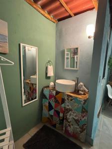 a bathroom with a sink and a mirror at Capacabana in Bacalar +49 photos