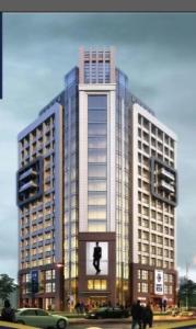 a tall building with a traffic light in front of it at Jiang Su Hotel in Brazzaville