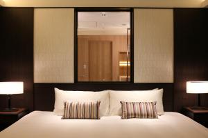 Postel nebo postele na pokoji v ubytování Hotel Allamanda Aoyama Tokyo