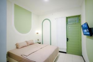 Postel nebo postele na pokoji v ubytování Kod Avlaha Bed & Coffee