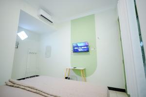 TV a/nebo společenská místnost v ubytování Kod Avlaha Bed & Coffee