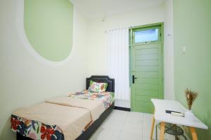 Postel nebo postele na pokoji v ubytování Kod Avlaha Bed & Coffee