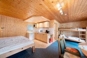 Ένα ή περισσότερα κρεβάτια σε δωμάτιο στο Bungalow 26 - Kimbucht