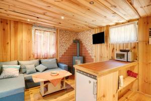 Televisyen dan/atau pusat hiburan di Bungalow 19 - Finnhütte