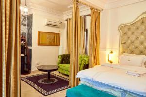 Ένα ή περισσότερα κρεβάτια σε δωμάτιο στο Convivium Home Hotel Appart