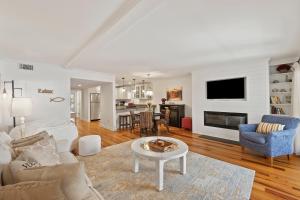 a living room with a couch and a table at SG7A: 7A Seagrove Villa in Isle of Palms