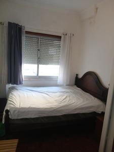 Postel nebo postele na pokoji v ubytování Benfica