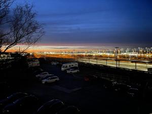 a parking lot with parked cars in a parking lot at YAYstay - Forest I 65m2 I Balcony I TV I Bahnhof in Mühldorf