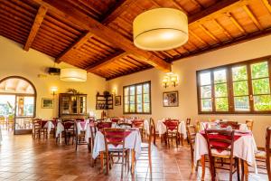 a restaurant with tables and chairs in a room at Agriturismo Marrucola in San Miniato