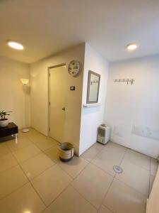 a room with a door and a clock on the wall at Lince Apartments in Lima +56 photos