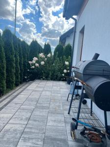 a grill sitting on the side of a house at Angela 的度假别墅 in Sękocin Stary