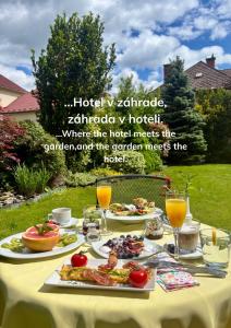 a table with food and drinks on it at Hotel Garni Expo in Banská Bystrica