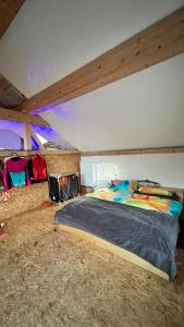 a bedroom with a large bed and a fireplace at Ölschnitzer Loft in Lampertswalde +29 photos