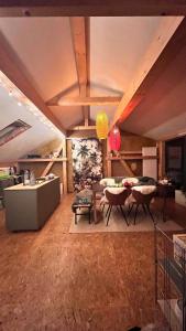 a living room with a couch and a table and chairs at Ölschnitzer Loft in Lampertswalde