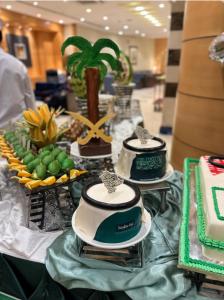 a table with three cakes on top at فندق برستيج اجياد in Ajyad