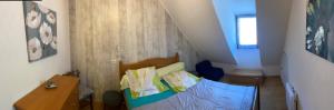 a small room with a bed and a staircase at Gite Clarabide in Loudenvielle +9 photos