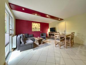 a living room with a couch and a table at Kegel in Lohsdorf +27 photos