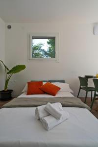 Postel nebo postele na pokoji v ubytování Residence Magnolia + 64 fotografií