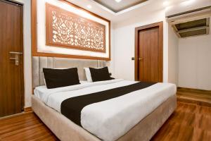 Ένα ή περισσότερα κρεβάτια σε δωμάτιο στο Hotel O THE SHAURYA INN