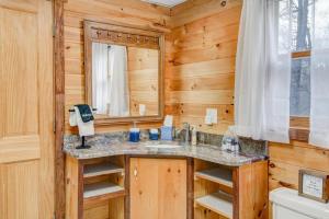a bathroom with a sink and a mirror at Misty Mornings Escape in Boone +44 photos