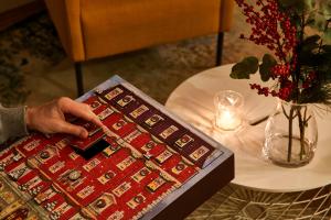 a person is typing on a board on a table at Residence Vocelova in Prague +44 photos