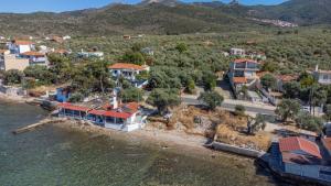 an aerial view of a house on the water at Lighthouse in Kallirakhi +16 photos