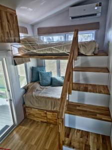 a bunk bed in a tiny house at Samui Tiny House villa Glamping, Seaview sleeps 8 in Koh Samui +64 photos