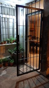 an open door to a room with potted plants at Casa Rawson in San Rafael
