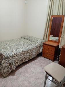 En eller flere senge i et værelse på Casa Rawson