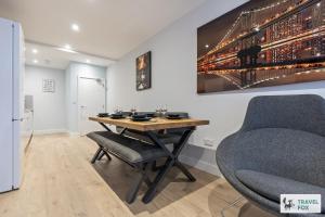 a table and chairs in a room with a painting on the wall at Blair's Central Stay in Nottingham +52 photos