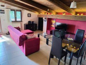 a living room with a couch and a table at MAREMONTI alloggio turistico in Formia